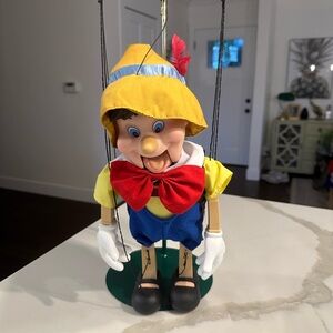 Pinocchio motion activated toy Puppet with Red Bow